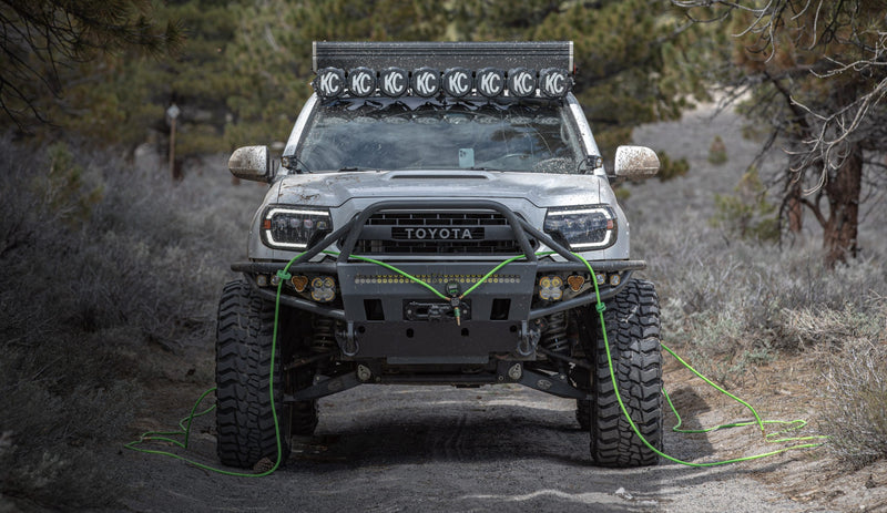 Toyota truck with off-road modifications in a natural setting